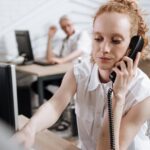 pexels-photo-8691834 Focused businesswoman making phone call at her desk in a modern office.